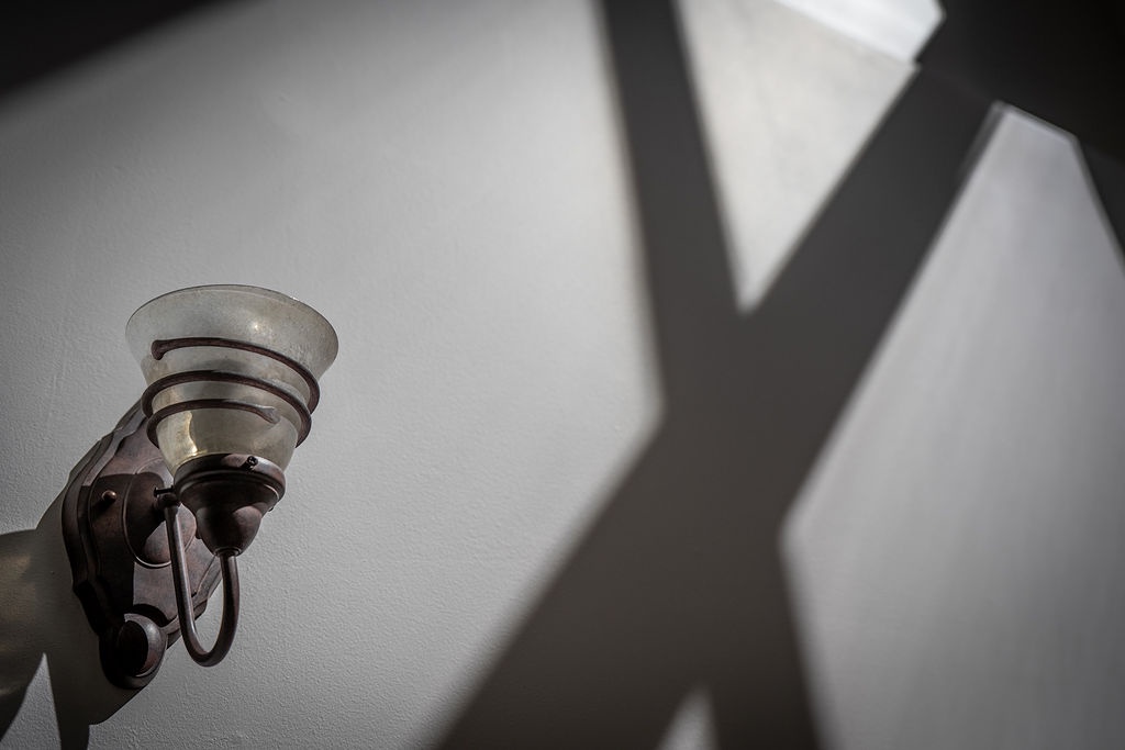 Artistic shadows dance across your walls, creating a serene atmosphere in your thoughtfully designed space.