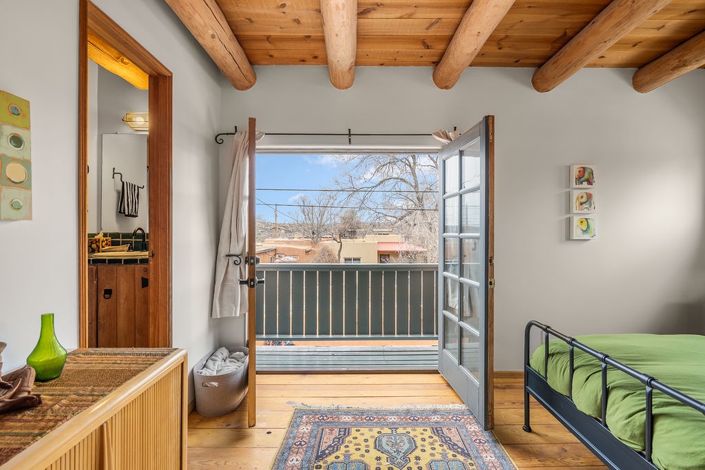 Step onto your private balcony and breathe in fresh air while soaking up stunning neighborhood views from this charming rustic retreat.