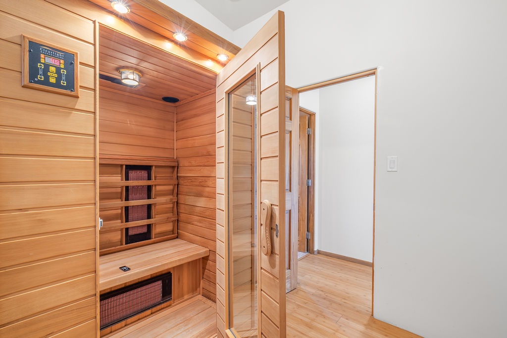 Step into your private infrared sauna sanctuary, where warm cedar walls and gentle heat create the perfect retreat for relaxation.