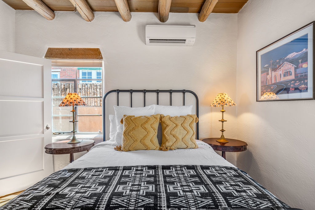 Relax in your cozy bedroom with southwestern charm, complete with a minisplit AC for comfort.