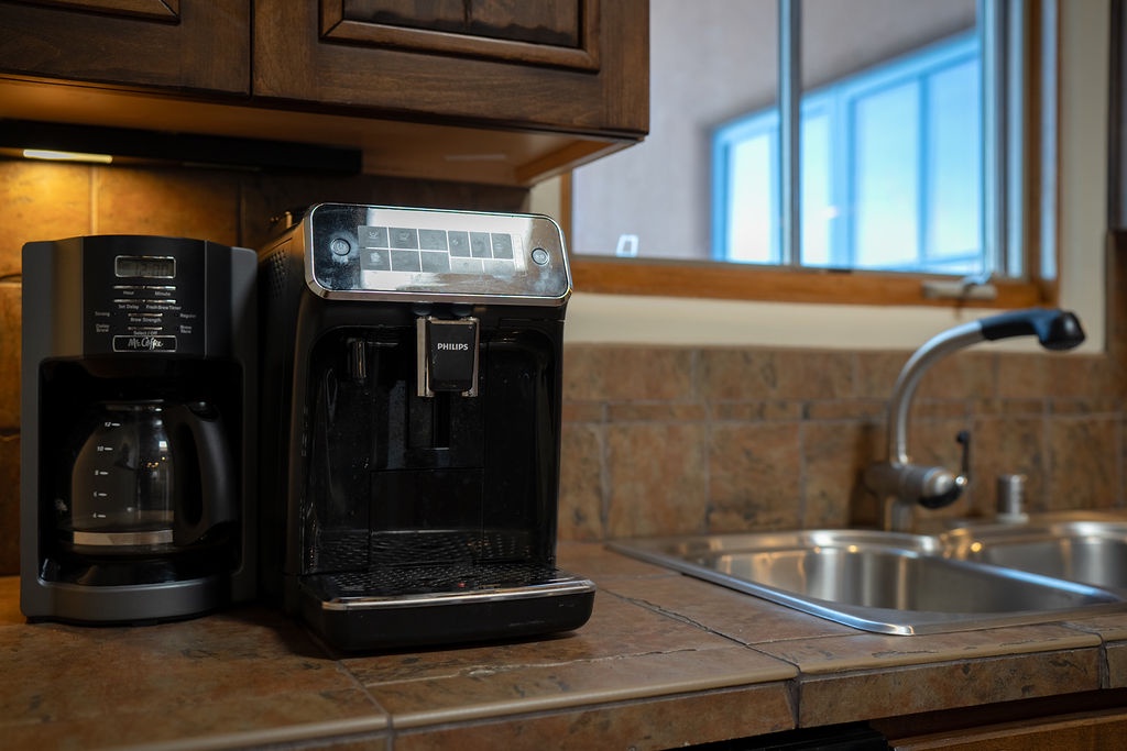 Wake up to fresh coffee from your fully equipped kitchen, complete with premium appliances and plenty of counter space for meal prep.