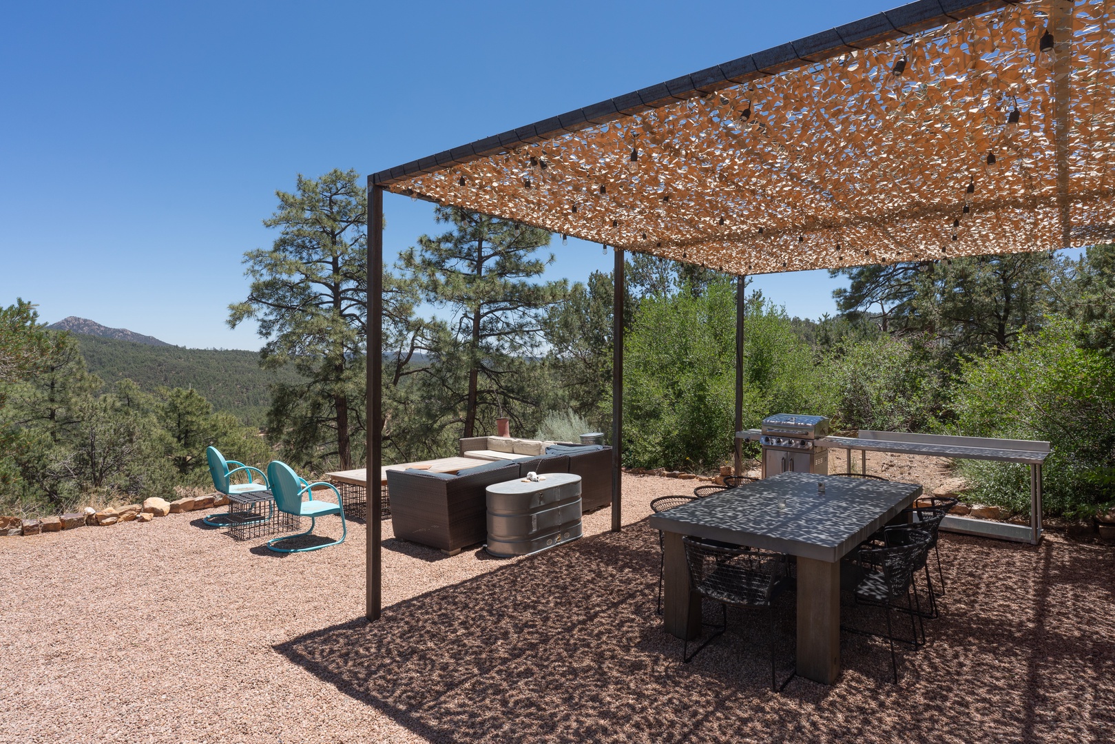 This outdoor space features a BBQ grill and a dining area perfect for relaxation and gatherings.