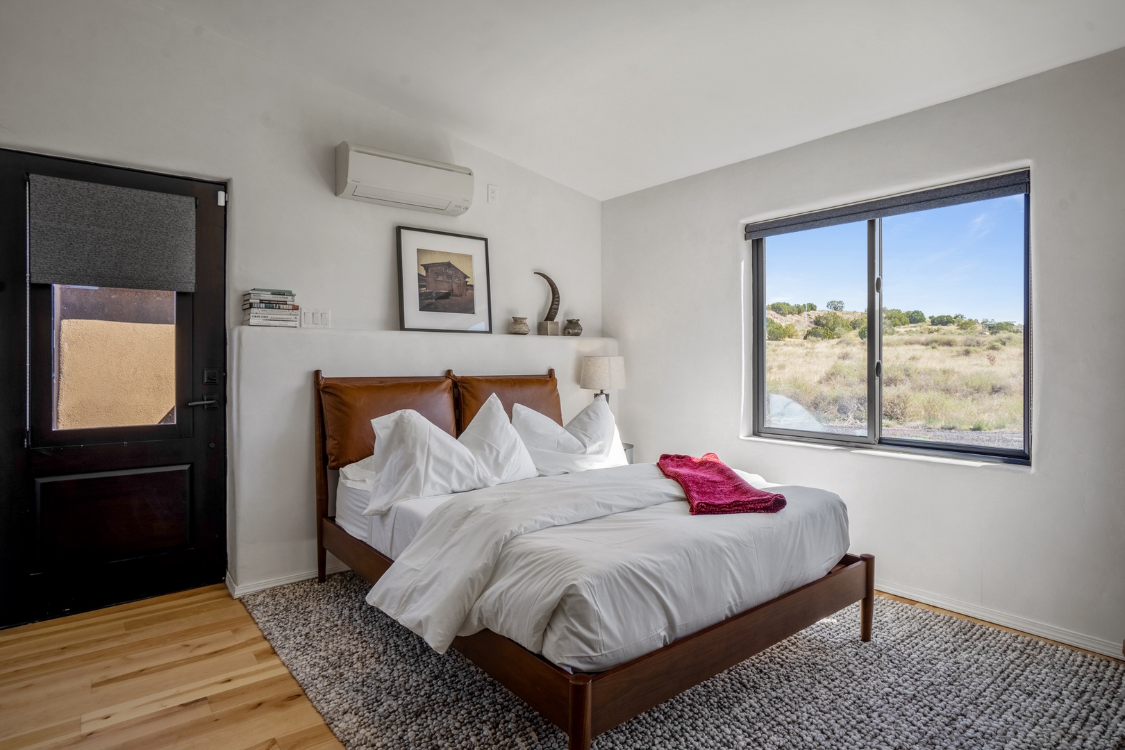 Wake up to desert views streaming through your bedroom window, where modern comfort meets natural beauty in this serene retreat.