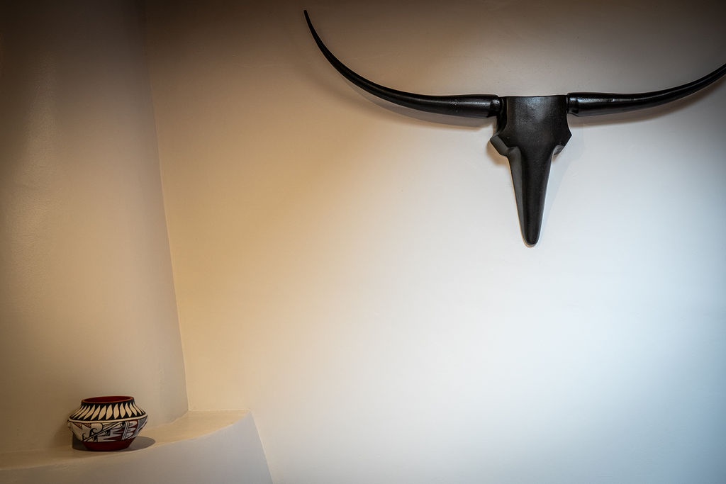 Relax in your space adorned with striking Southwestern décor, where authentic pottery and bold wall art create a distinctive, culturally rich atmosphere.