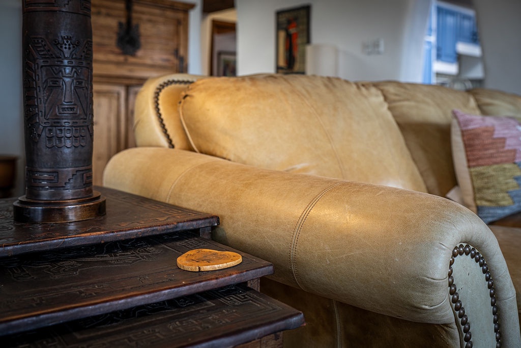 Sink into luxurious leather comfort where rustic charm meets elegance, creating your perfect retreat for unwinding after exploring.