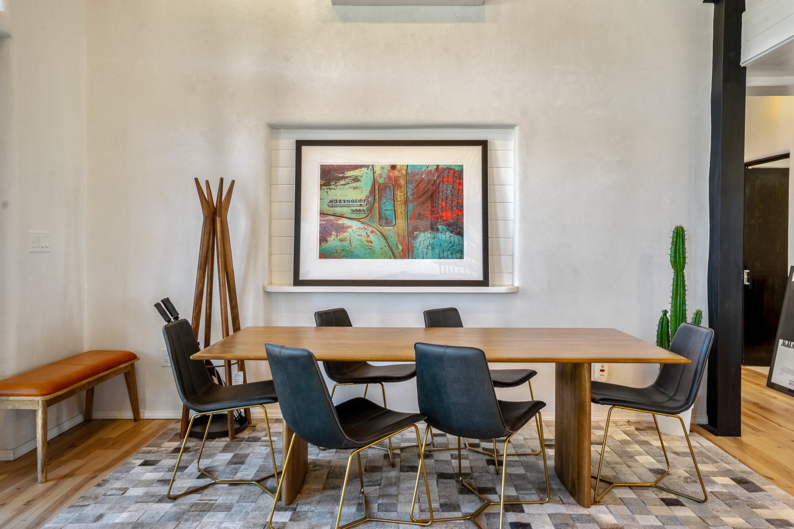 Gather around your elegant dining table with comfortable seating for six, where warm wood tones and stylish décor create the perfect atmosphere for memorable meals together.