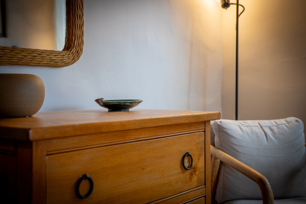 Unwind in your thoughtfully appointed space with warm wood furnishings and soft lighting creating the perfect ambiance for relaxation.