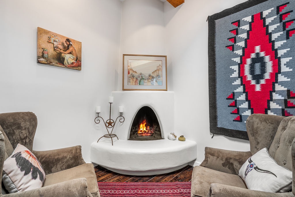 Curl up in your cozy corner fireplace nook, where crackling flames and comfortable armchairs create the perfect spot for evening conversations.