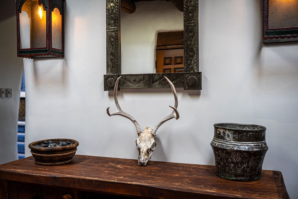 Discover authentic southwestern charm with hand-carved mirrors, artisan pottery, and rustic details that create your perfect desert retreat atmosphere.