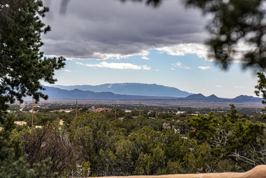 Expansive mountain vistas stretch across the high desert landscape, framed by towering peaks and rolling foothills.