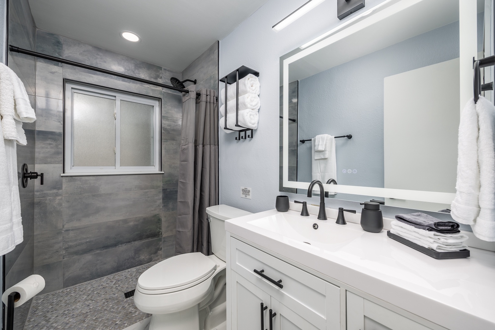 Step into your beautifully renovated bathroom featuring a spacious walk-in shower and elegant fixtures for a refreshing start to your day.