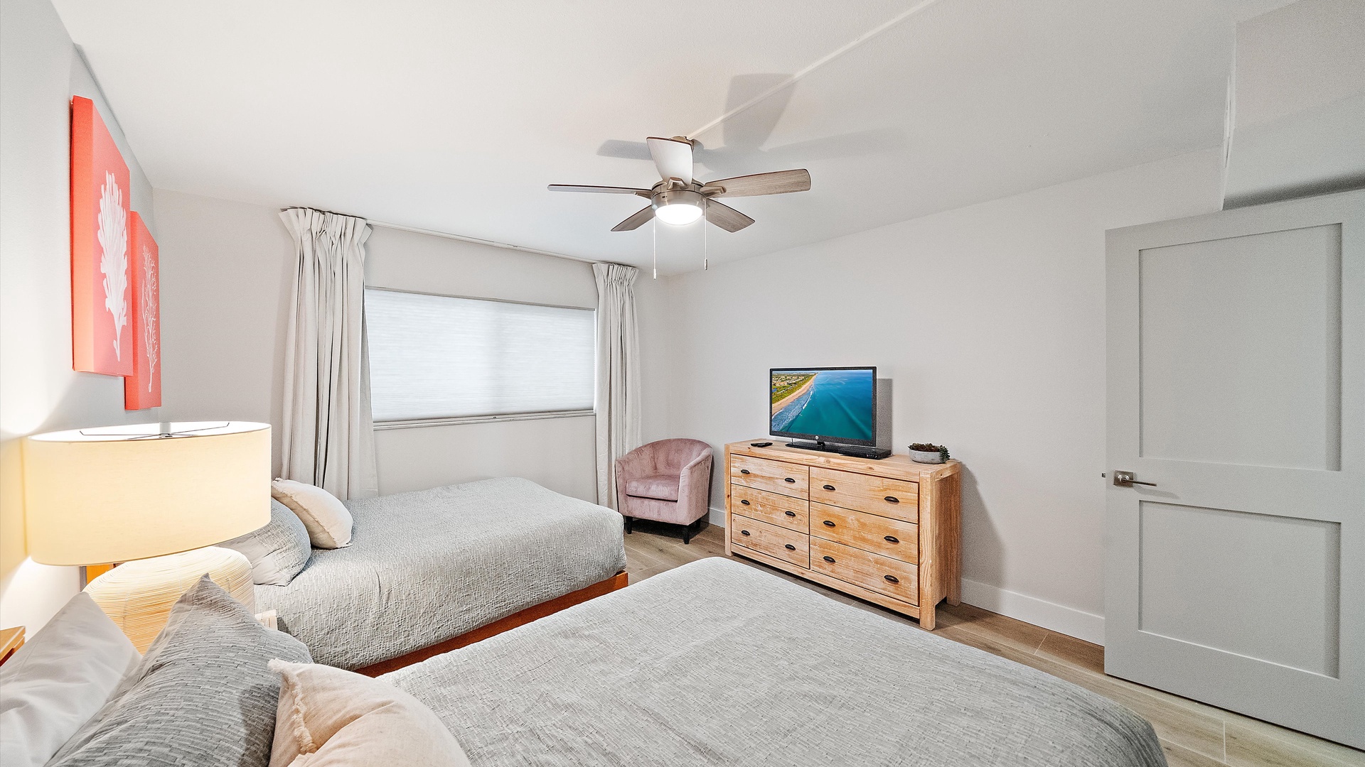 Your peaceful bedroom features twin beds with soft linens, plus a TV and cozy chair for relaxing after adventurous days.