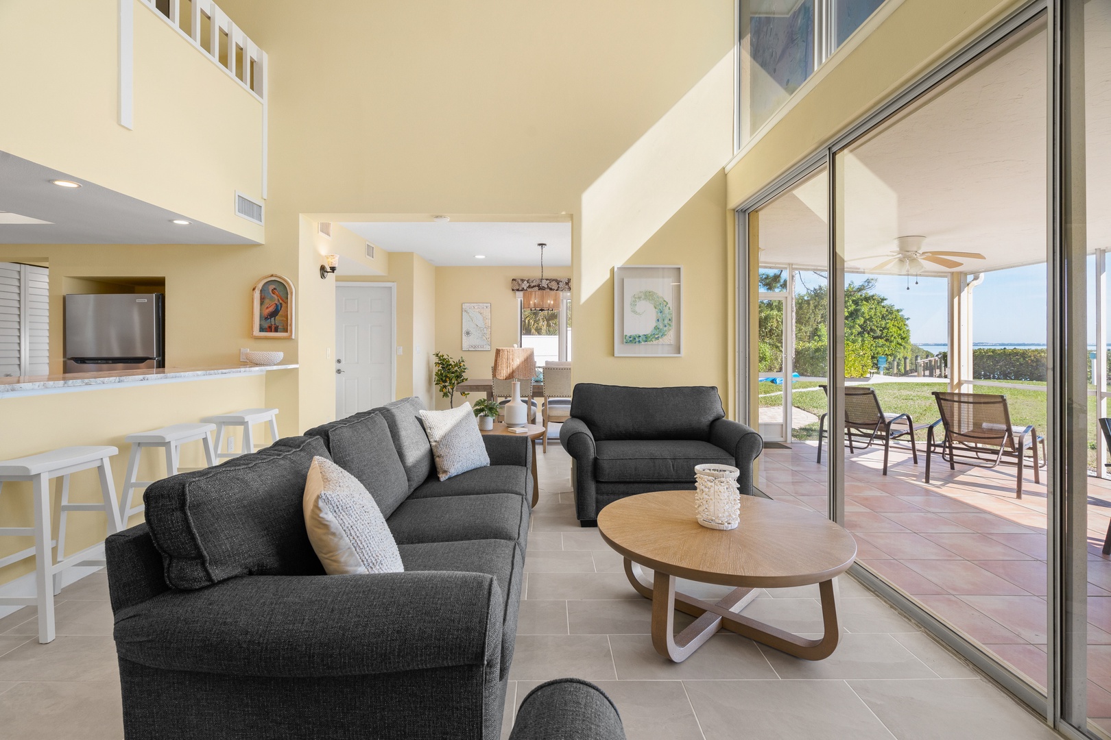 Relax in your bright, open living space with modern furnishings and seamless patio access for the perfect indoor-outdoor experience.