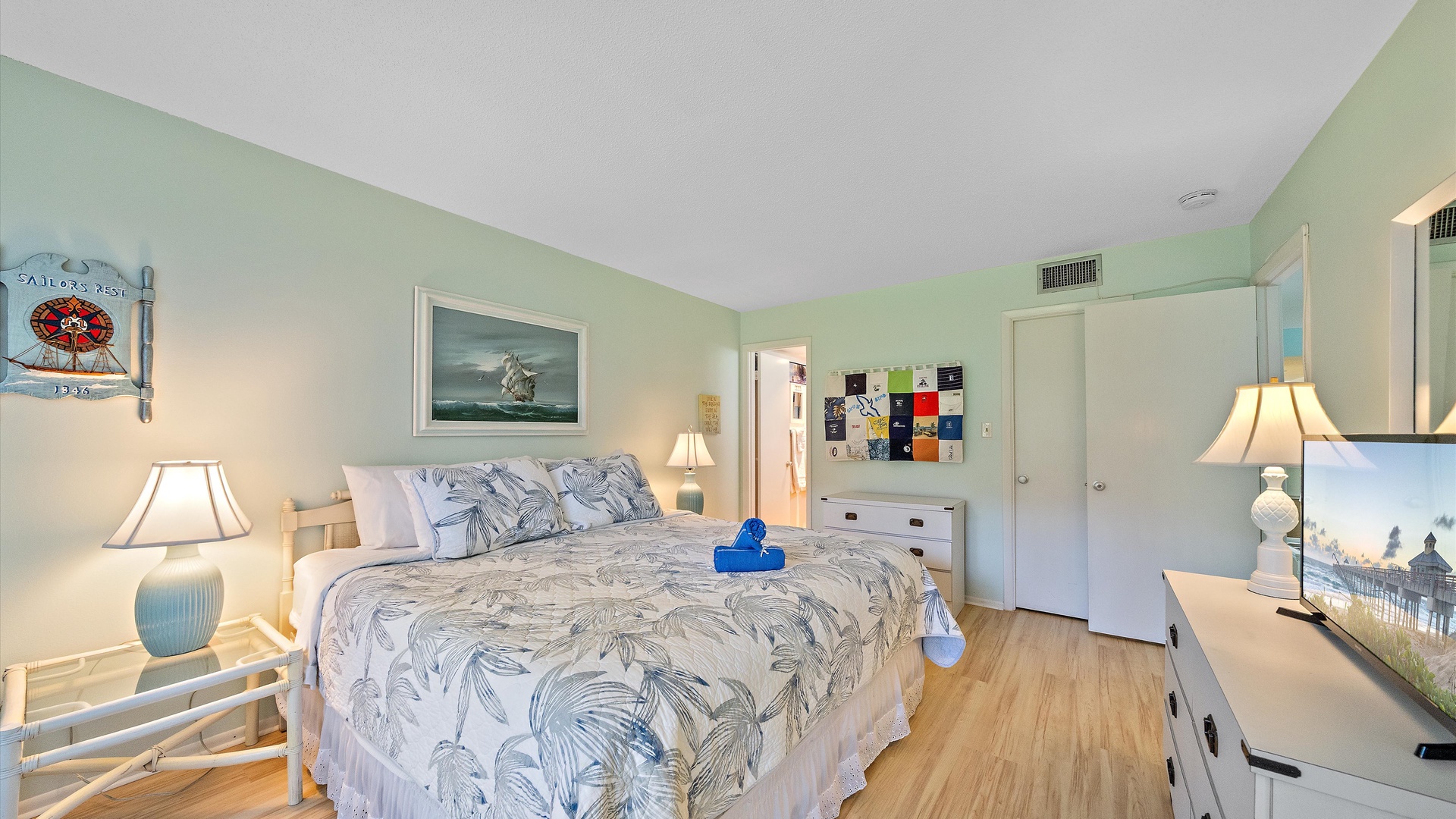 Drift off in this breezy coastal bedroom with soft linens, beachy accents, and calming ocean-inspired hues—your perfect retreat after a sun-soaked day.