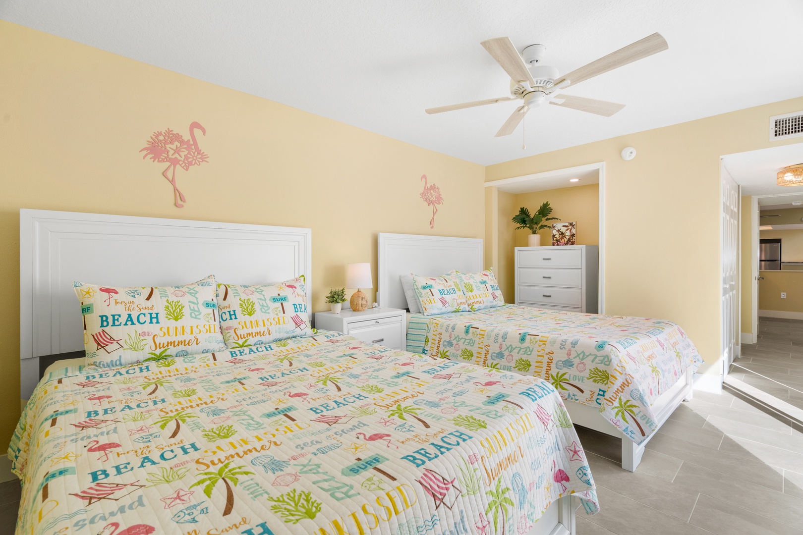 Wake up in your cheerful beach-themed bedroom with two comfortable beds and tropical decor that instantly puts you in vacation mode.