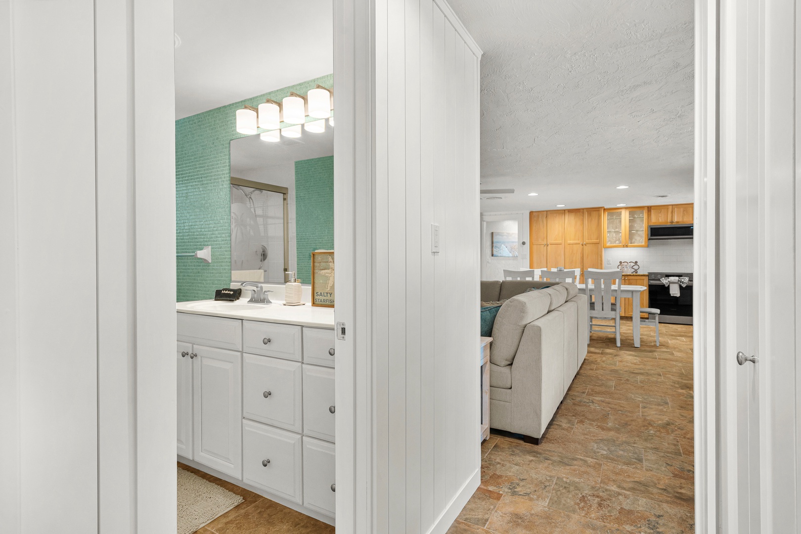 Step inside to discover a bright, open layout connecting your living spaces. Warm wood flooring flows from the welcoming living area into your dining spot and fully equipped kitchen.