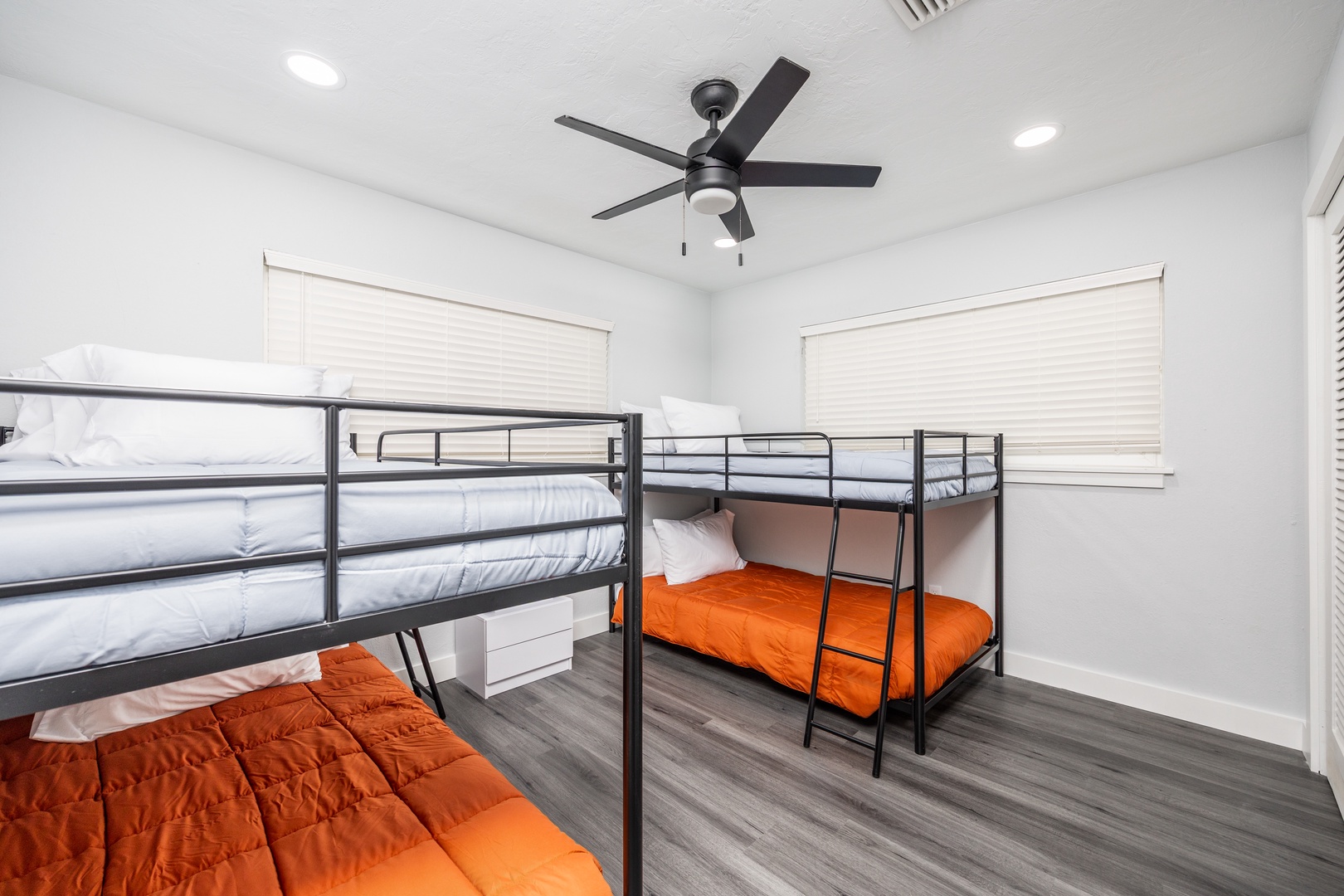 Your group will love this bright bunk room with comfortable beds and cheerful orange bedding for a restful night's sleep.