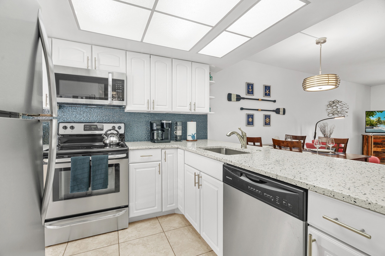 The spacious kitchen opens up to the bright and colorful main living space - perfect for socializing with friends and family.