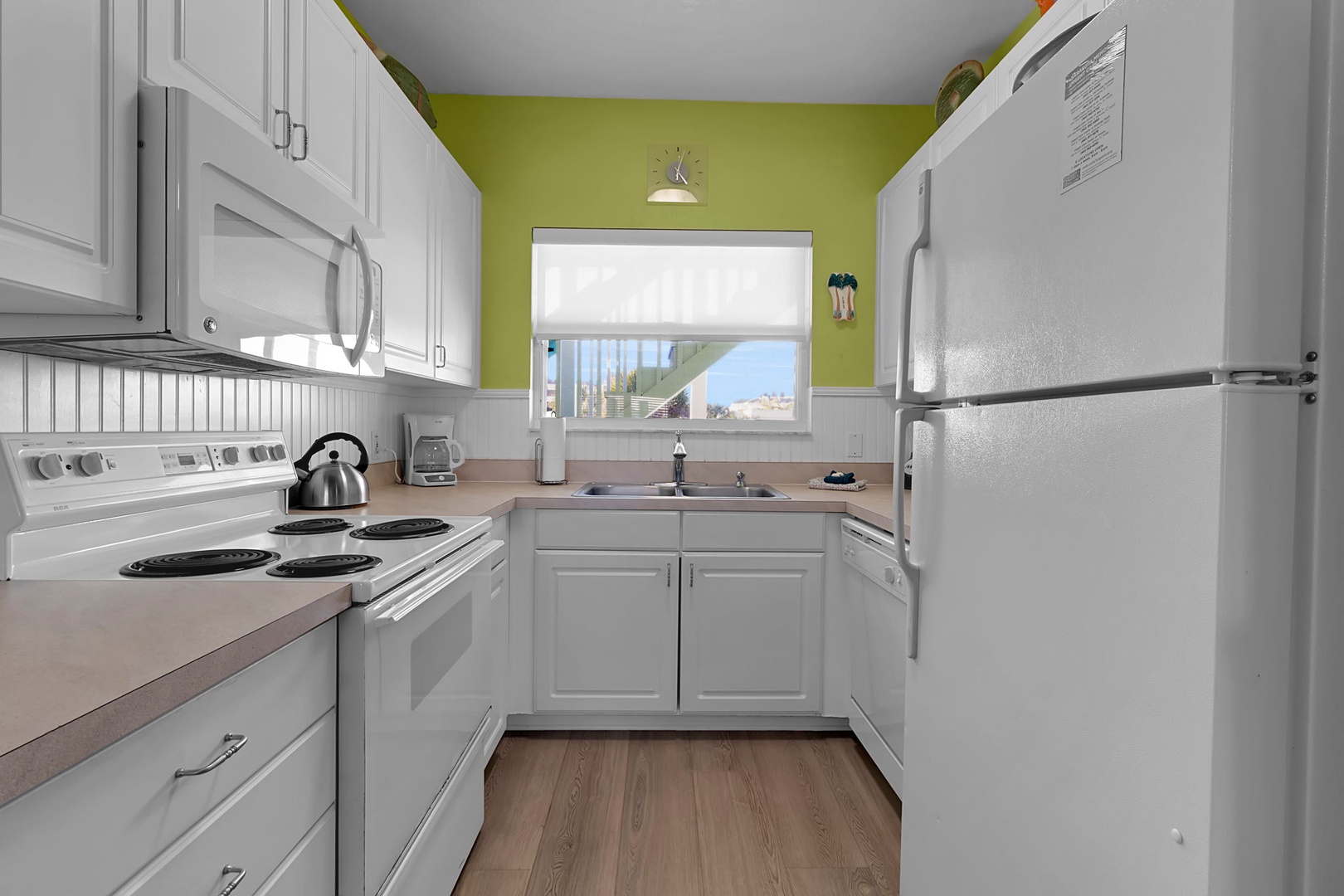 Your fully equipped kitchen features everything you need to prepare meals during your stay, with ample counter space and a cheerful pop of color to inspire your inner chef.