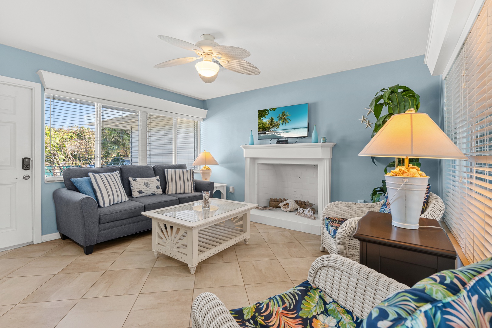 Cozy living area with patio access and beach views. Just steps away from Longboat Key Beach.