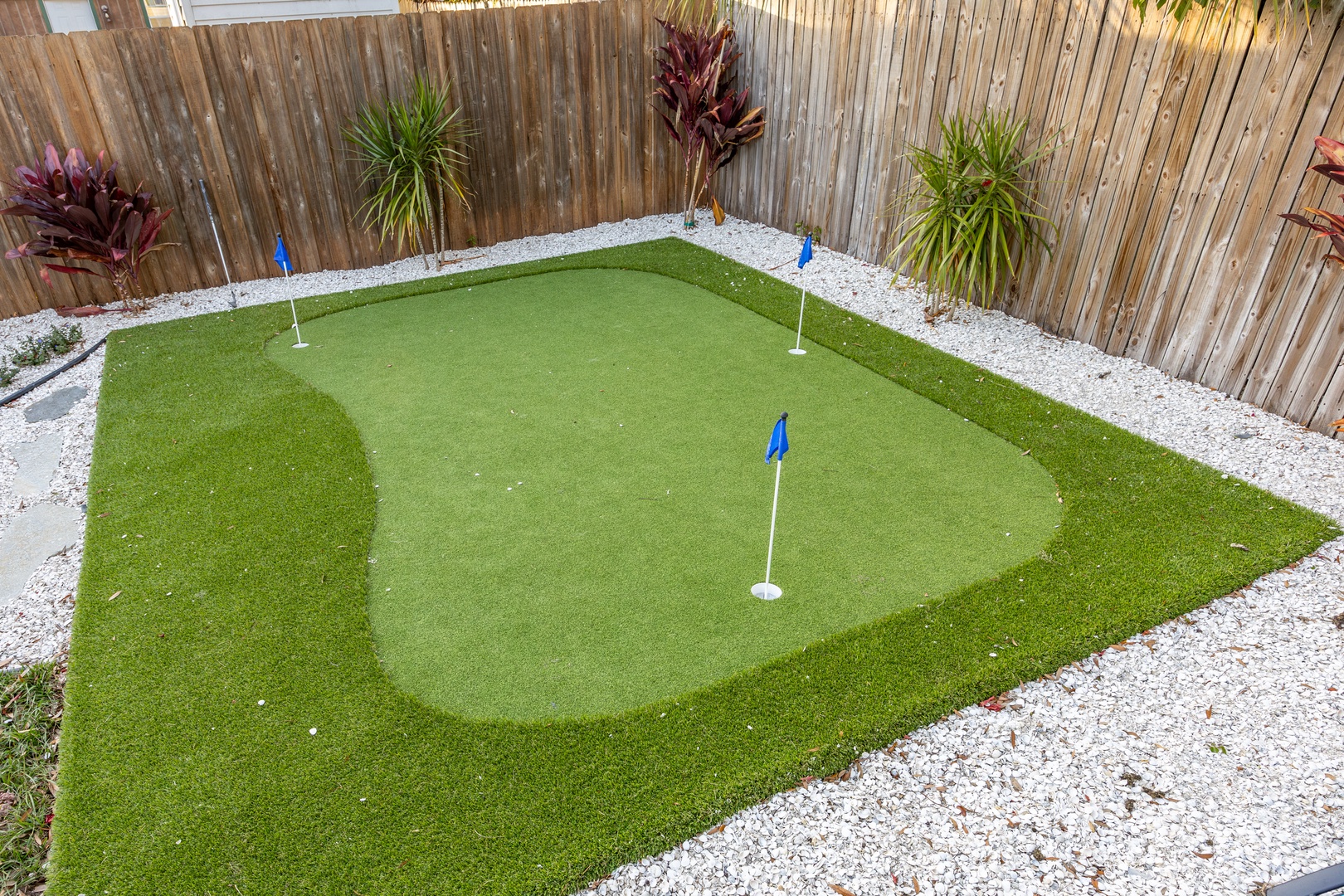 Perfect your putting game on your private backyard green, surrounded by tropical landscaping.