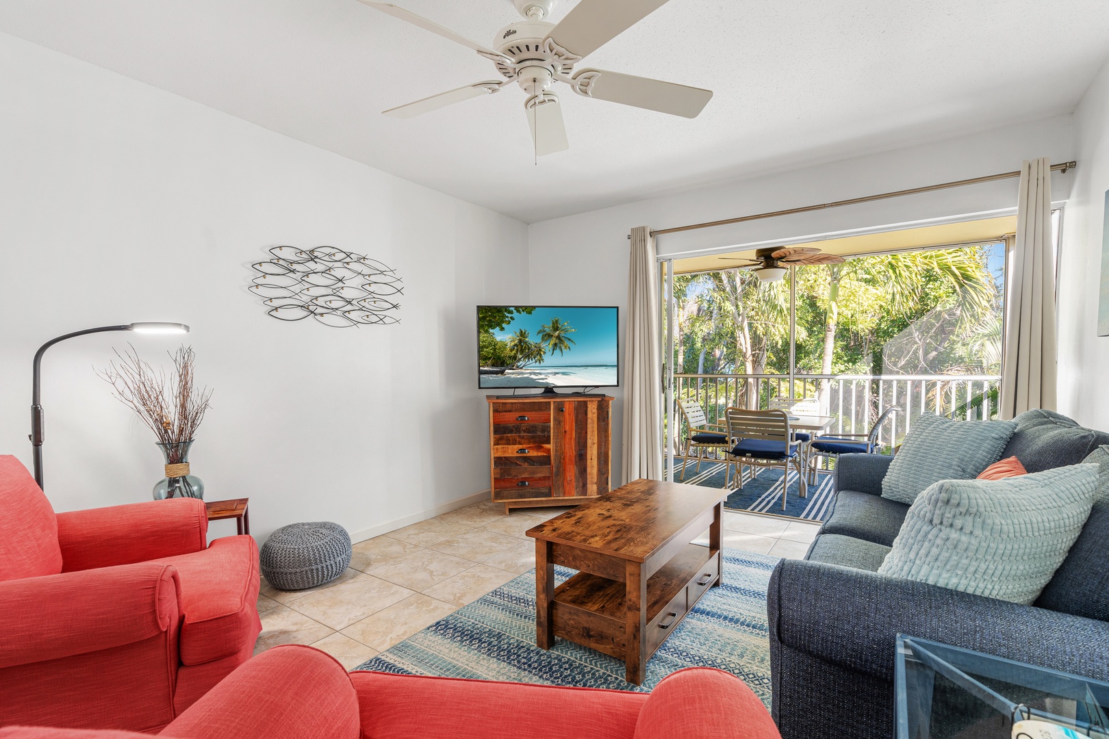Inviting open living space with Smart TV and private patio access.