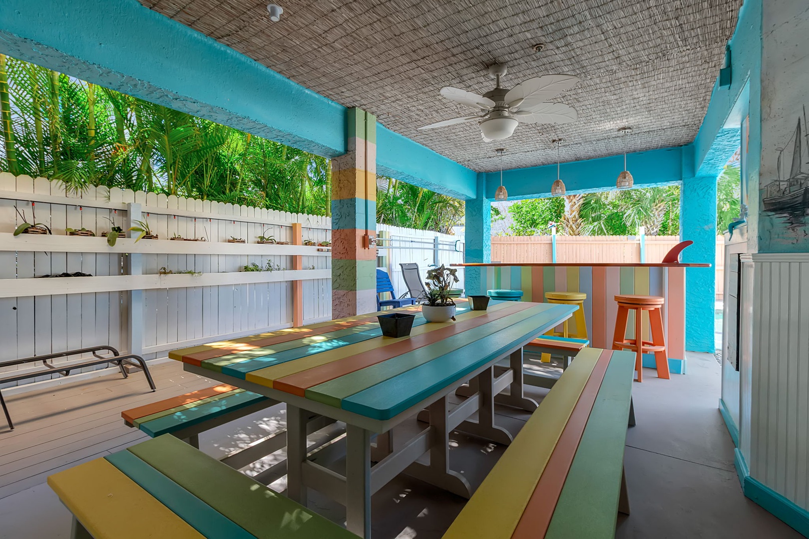 Gather around this bright, beachy dining space where colorful benches and tropical breezes set the scene for memorable meals and easy conversation with your travel crew.