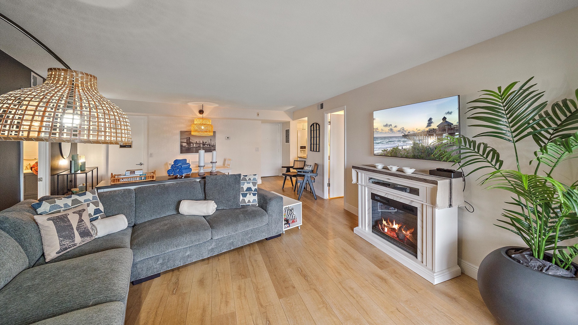 Cozy living room with comfortable seating, warm fireplace, and modern amenities - your perfect space to unwind after exploring the area.