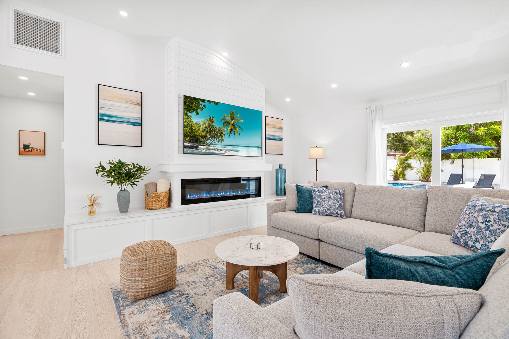 Unwind in the spacious living area, with Smart TV, fireplace, where natural light pours through elegant French doors that lead to the pool.
