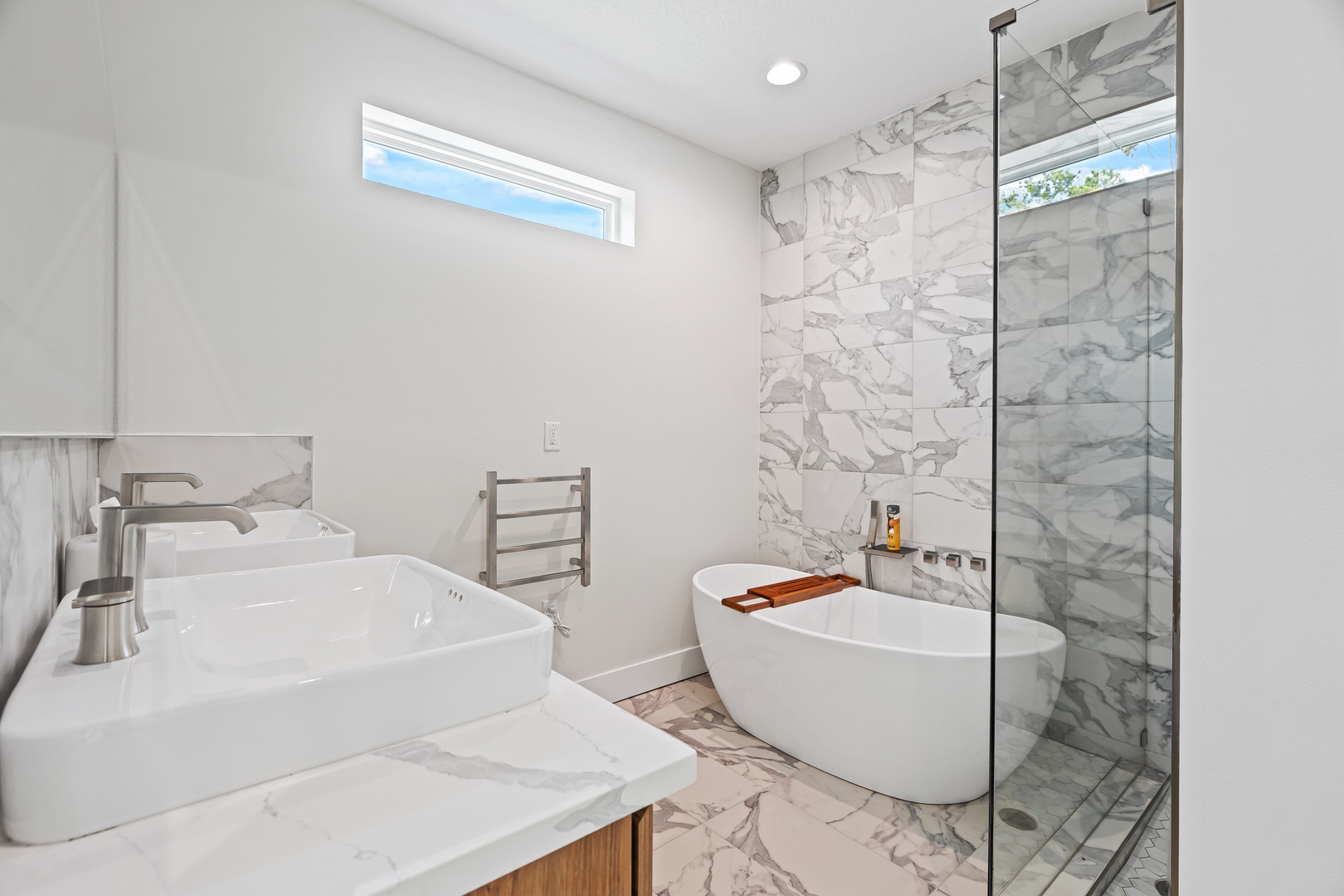 Sink into a spa-like soak after a day of exploring. Marble details, bright natural light, and a standalone tub create the perfect retreat for unwinding and recharging.