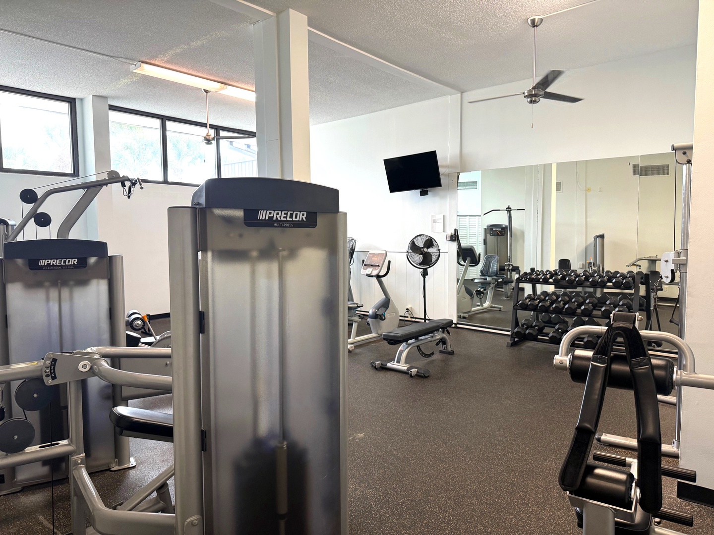 Stay fit during your stay with our fully-equipped fitness center featuring modern Precor machines, free weights, and cardio equipment.