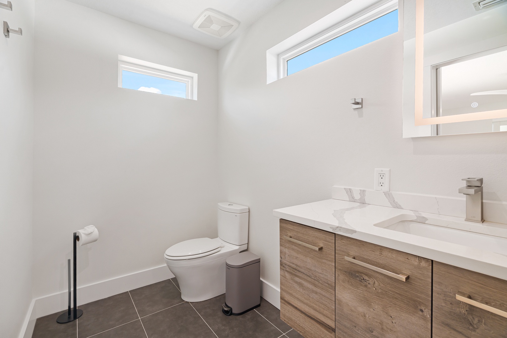 Refresh in your bright, modern bathroom with natural light and clean lines—everything you need to feel at home.