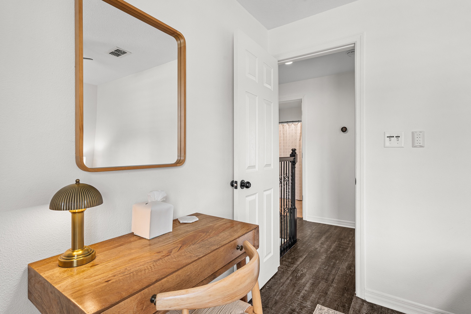 Slip away to your private workspace, where warm wood tones and soft lighting create the perfect spot for planning your next adventure or simply unwinding.