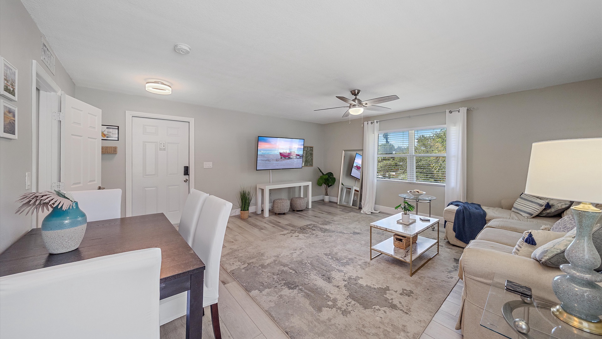Your bright, open living space invites relaxation with soft natural light, comfortable seating, and a ceiling fan to keep you cool on warm afternoons.