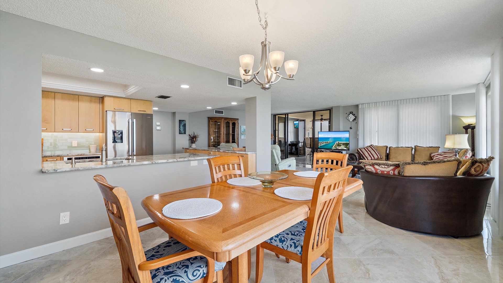 Step into your open-plan retreat where kitchen, dining, and living spaces flow together perfectly for memorable meals and relaxation.