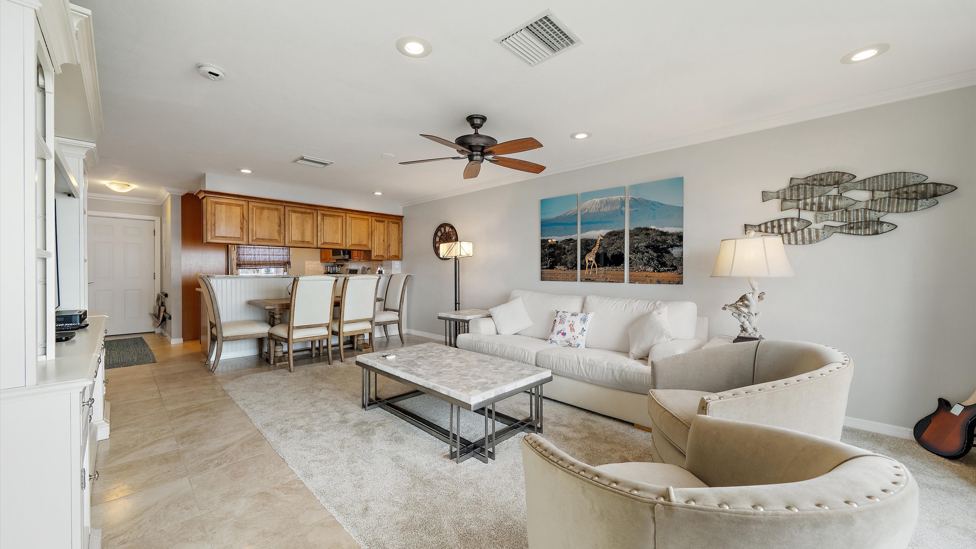 Room to linger, dine, and enjoy being together. Soft coastal tones, inviting lounge seating, and dining for four give this Longboat Key penthouse the relaxed elegance of a waterfront home.