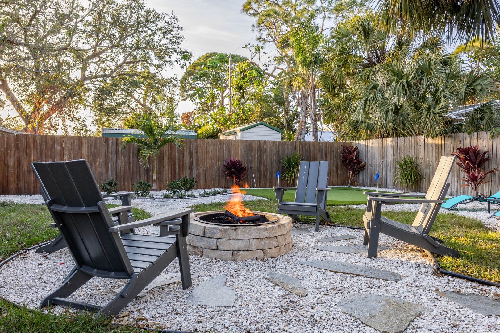 Gather around your private fire pit as flames dance under tropical palms, creating the perfect spot for evening conversations and s'mores.