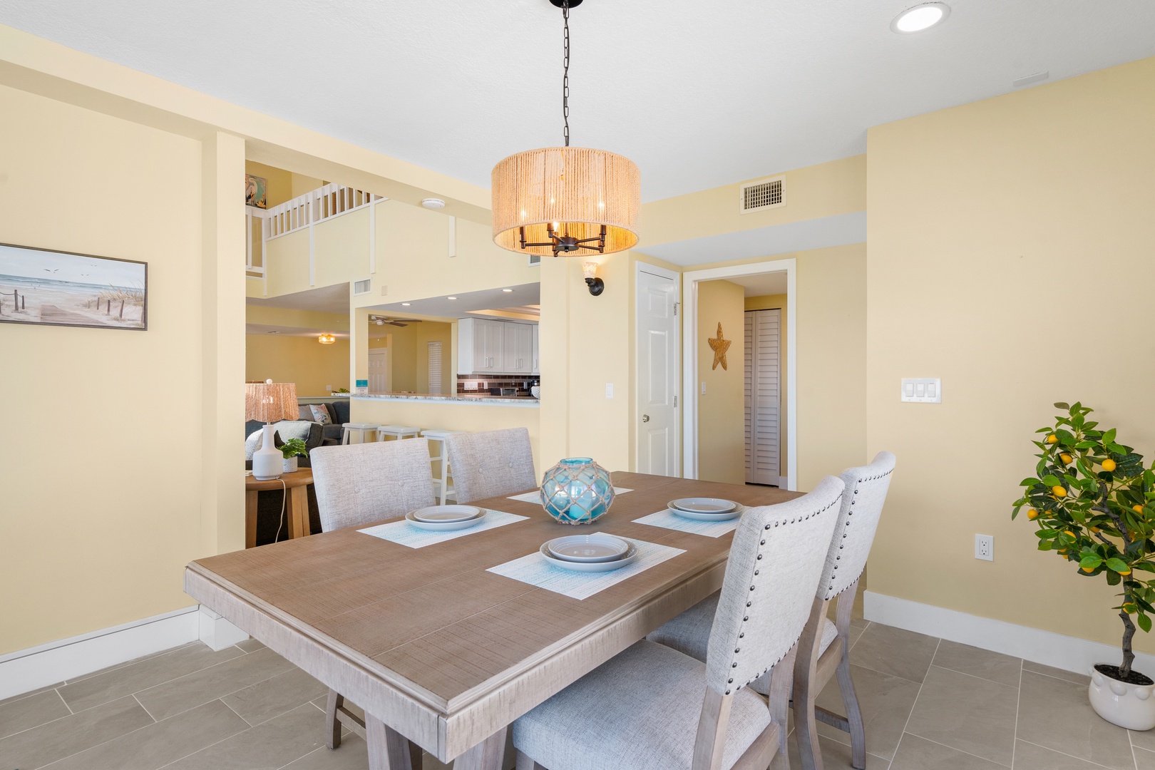 Gather around your spacious dining table with warm pendant lighting and open sightlines to the kitchen for effortless entertaining.