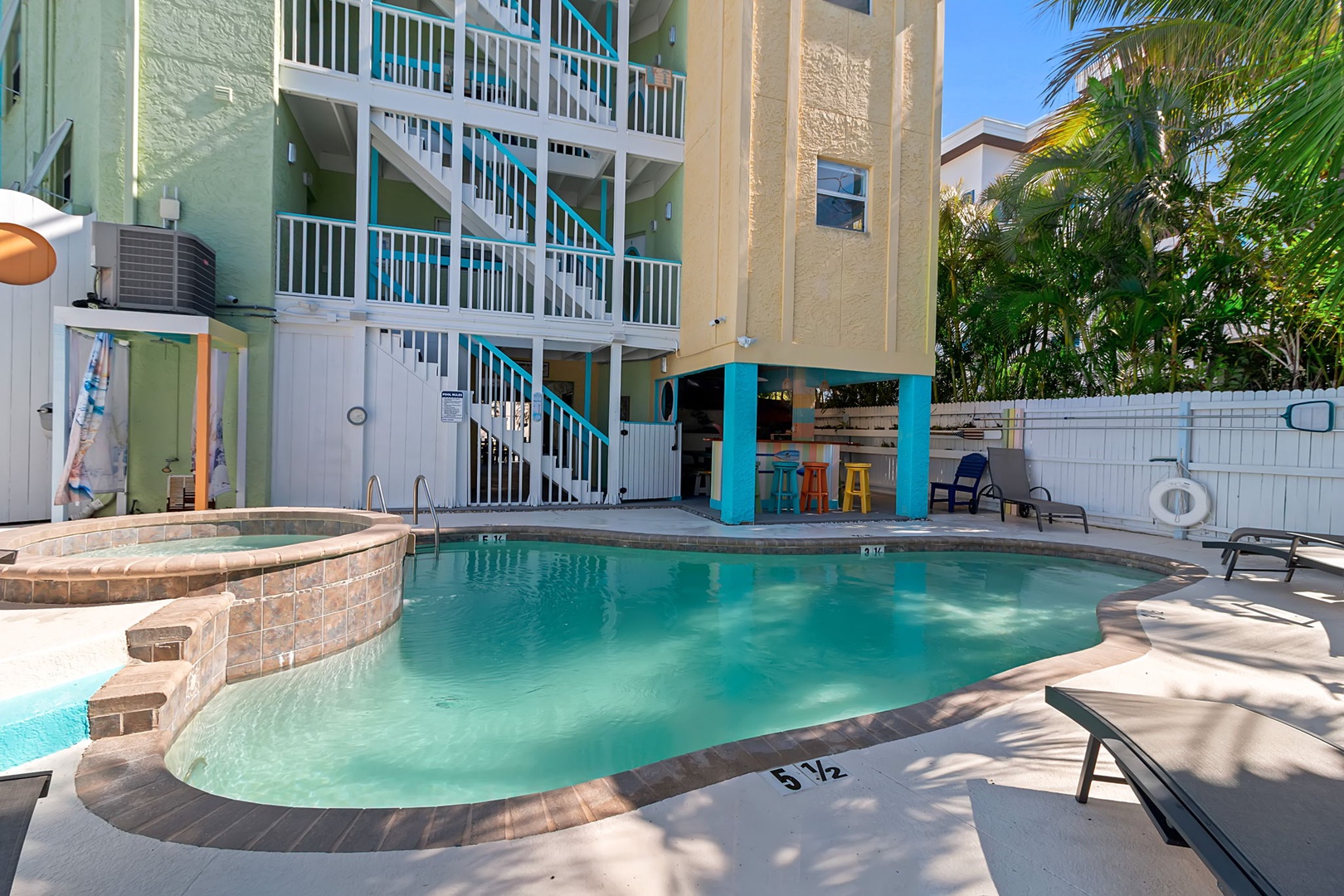 Your private oasis awaits—sink into turquoise waters surrounded by swaying palms, a warm breeze, and vibrant tropical energy that invites you to unwind.