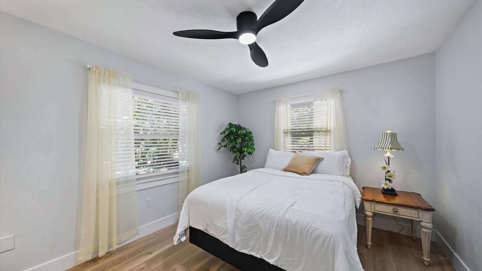 Settle into your peaceful retreat with soft linens, natural light, and a gentle ceiling fan to keep you cool and comfortable.