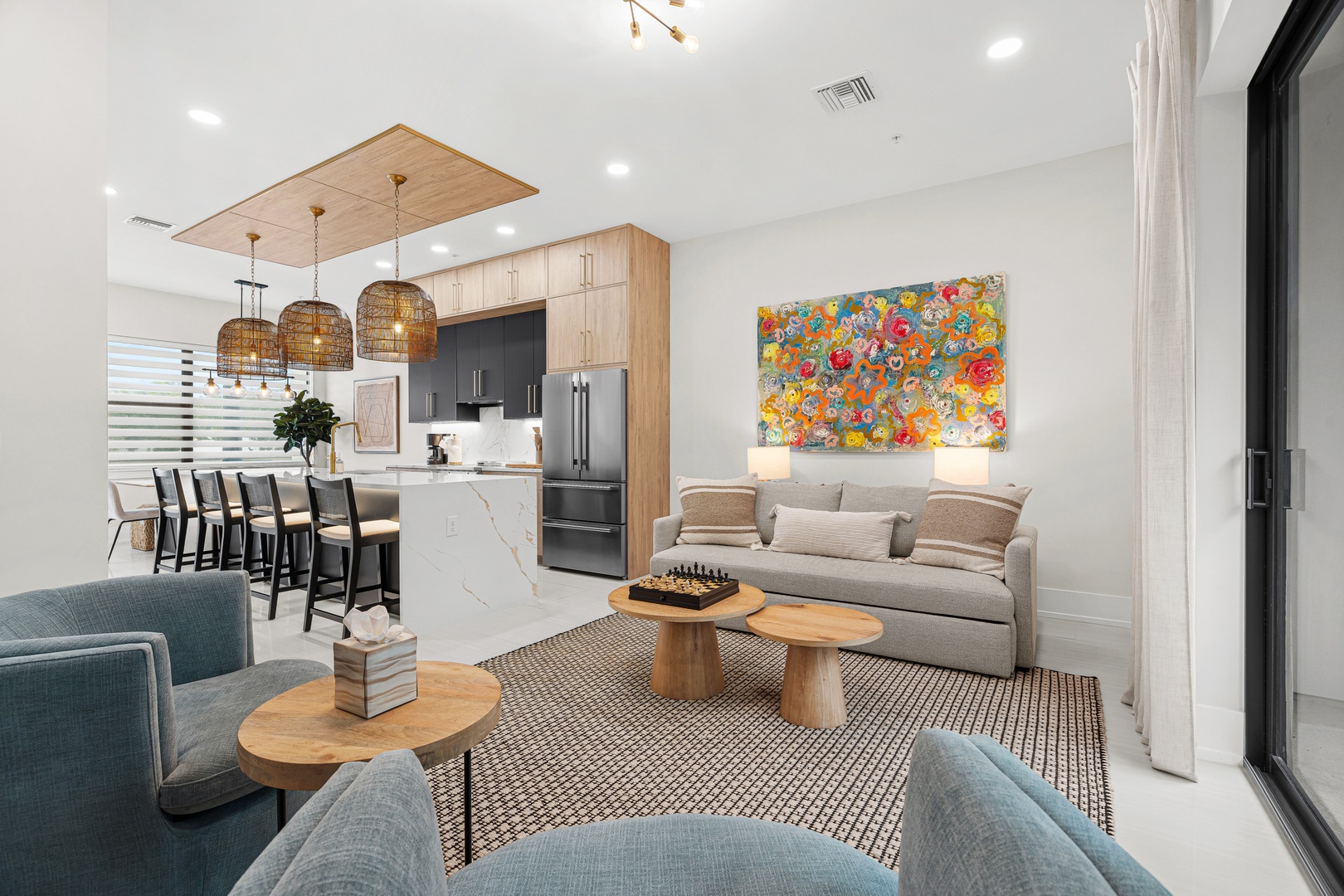 Beautifully designed modern open-concept space with fully stocked kitchen, games, and plenty of seating for gatherings.