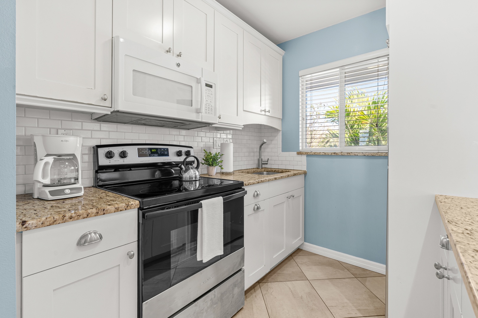 Your fully equipped kitchen features granite counters, stainless appliances - perfect for preparing meals in style.