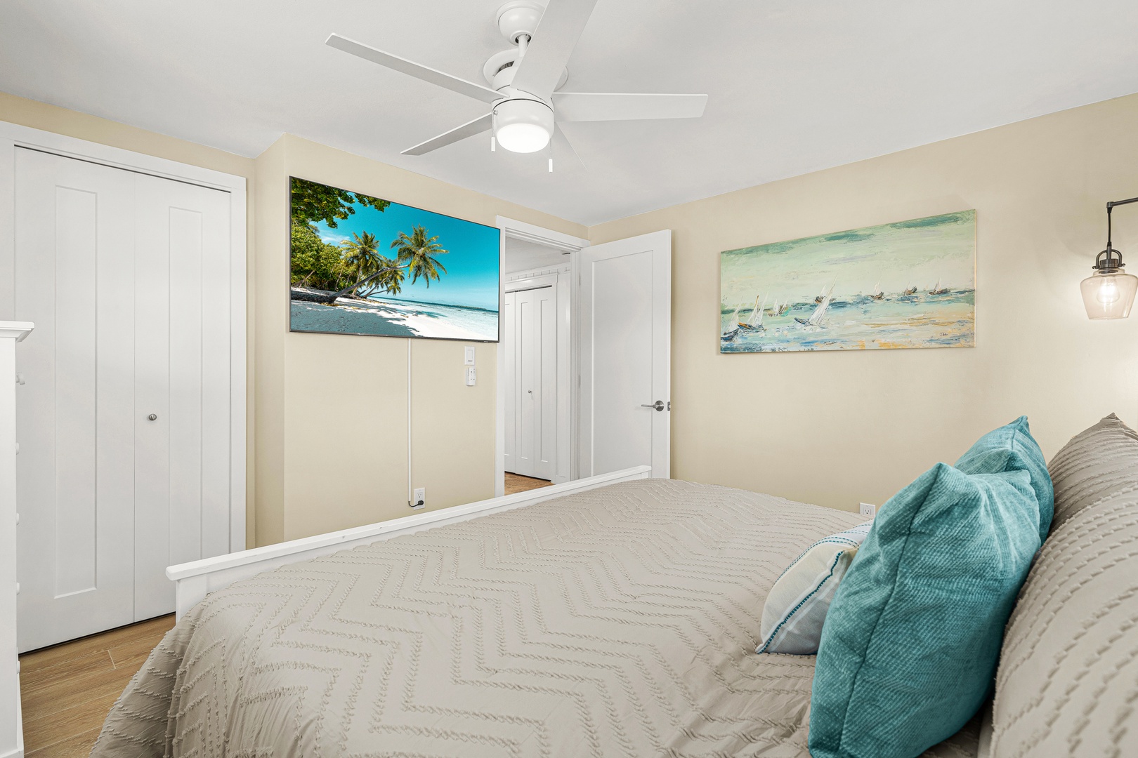 Drift off in your serene coastal retreat with soft beachy tones, a plush queen bed, and gentle breezes from the ceiling fan keeping you perfectly comfortable.