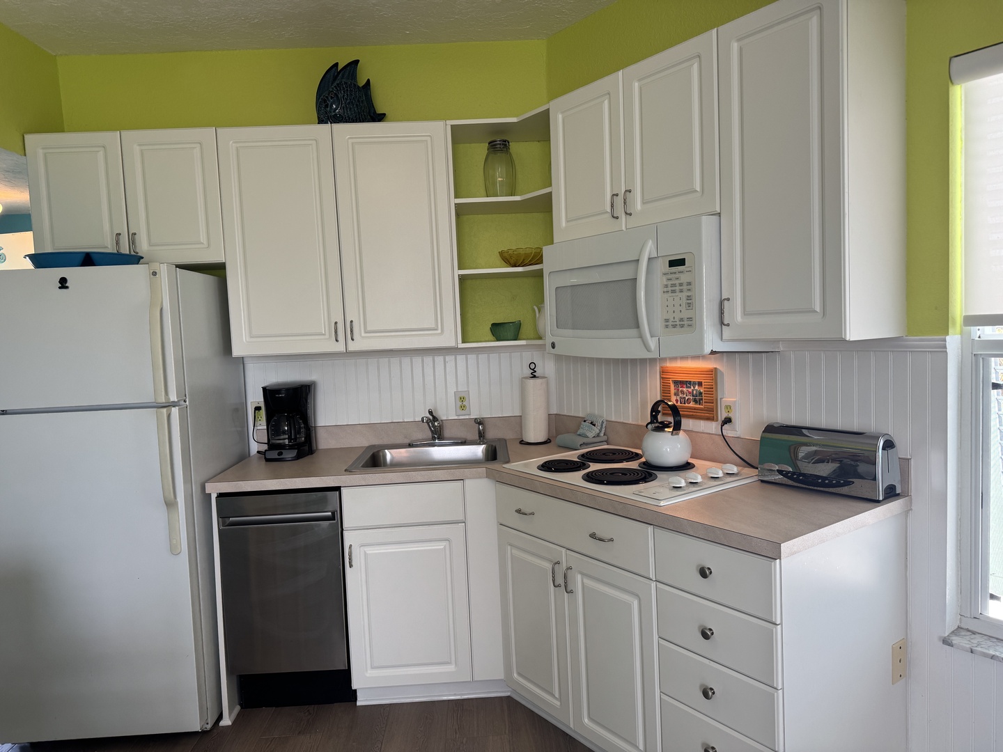 Your bright, fully equipped kitchen makes meal prep a breeze with a full stove, microwave, toaster oven, coffee maker, and dishwasher—everything you need to feel right at home.