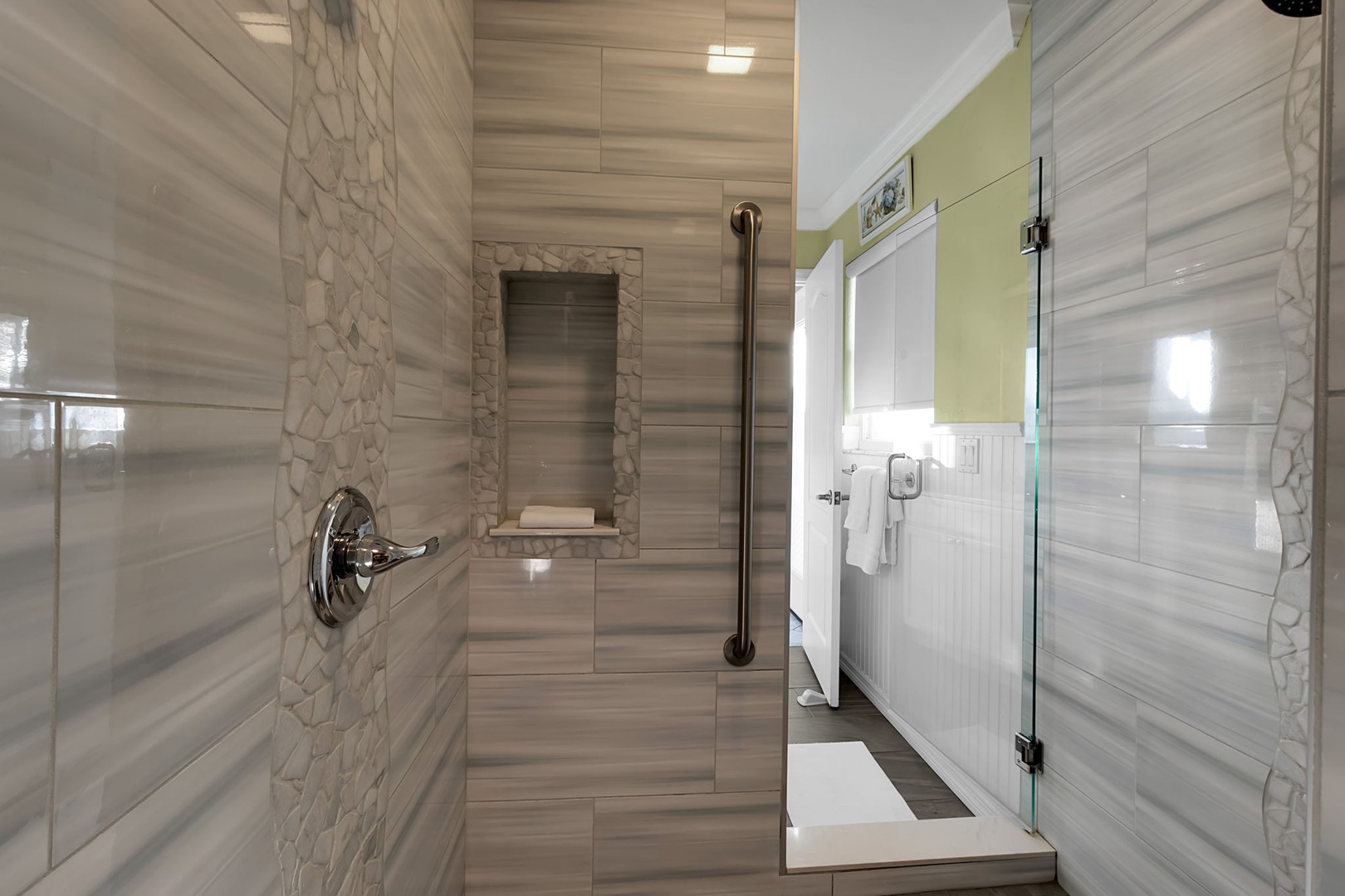 Step into your beautifully tiled walk-in shower with a convenient built-in bench and modern fixtures. Clean, spacious, and designed for ultimate comfort.