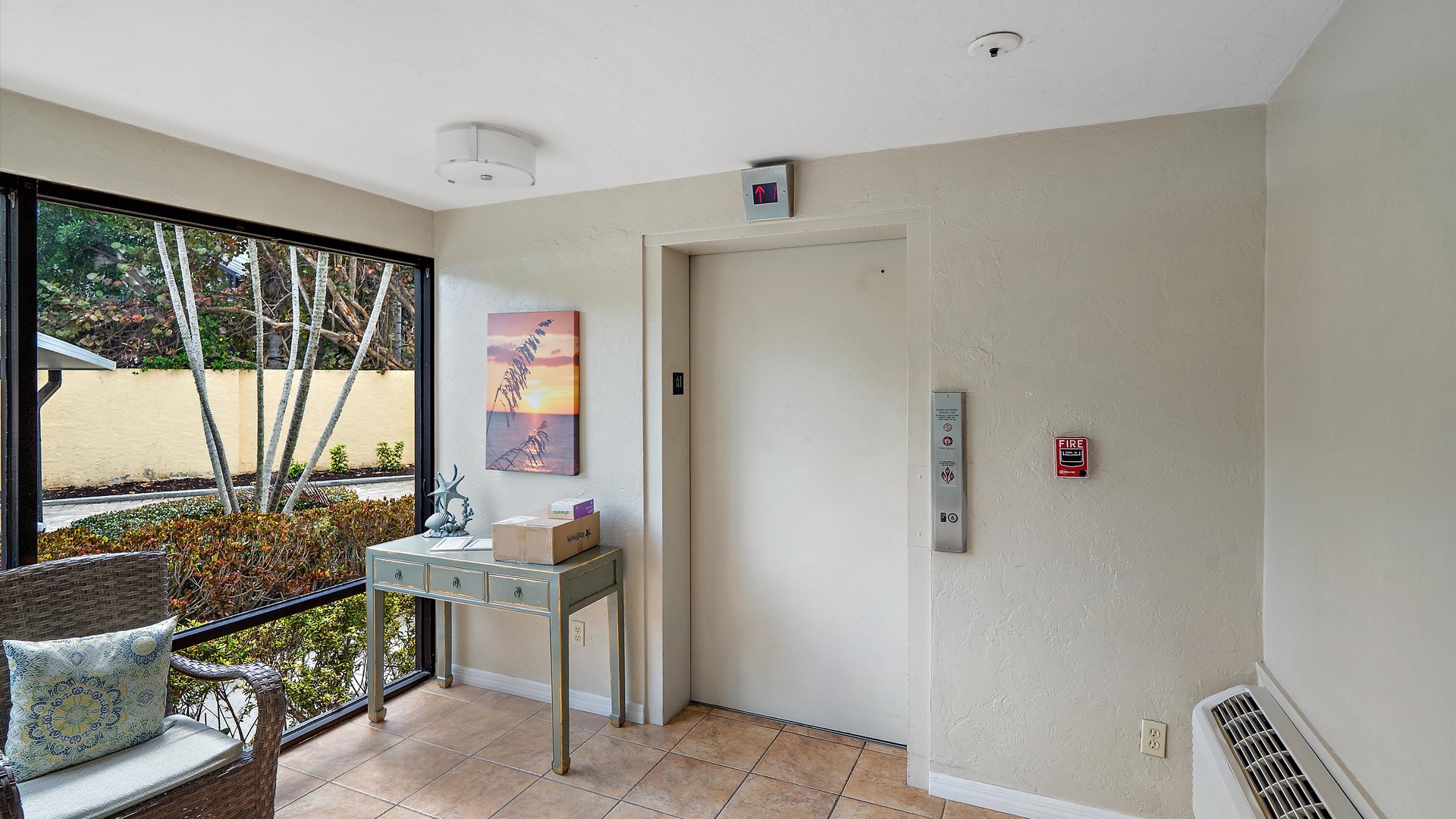 Step into your modern lobby where natural light streams through large windows, creating a bright, welcoming space for your arrival.