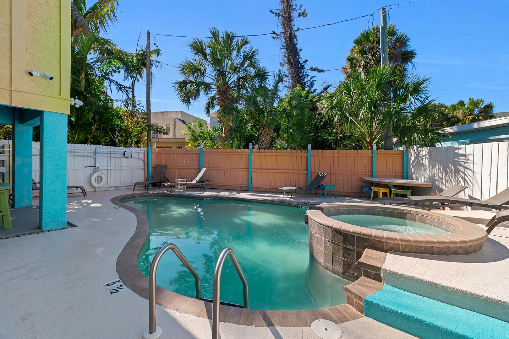 Your private tropical oasis awaits—a sparkling pool and spa surrounded by swaying palms, all just steps from your door. Picture warm sunshine, gentle breezes, and leisurely afternoons spent poolside.