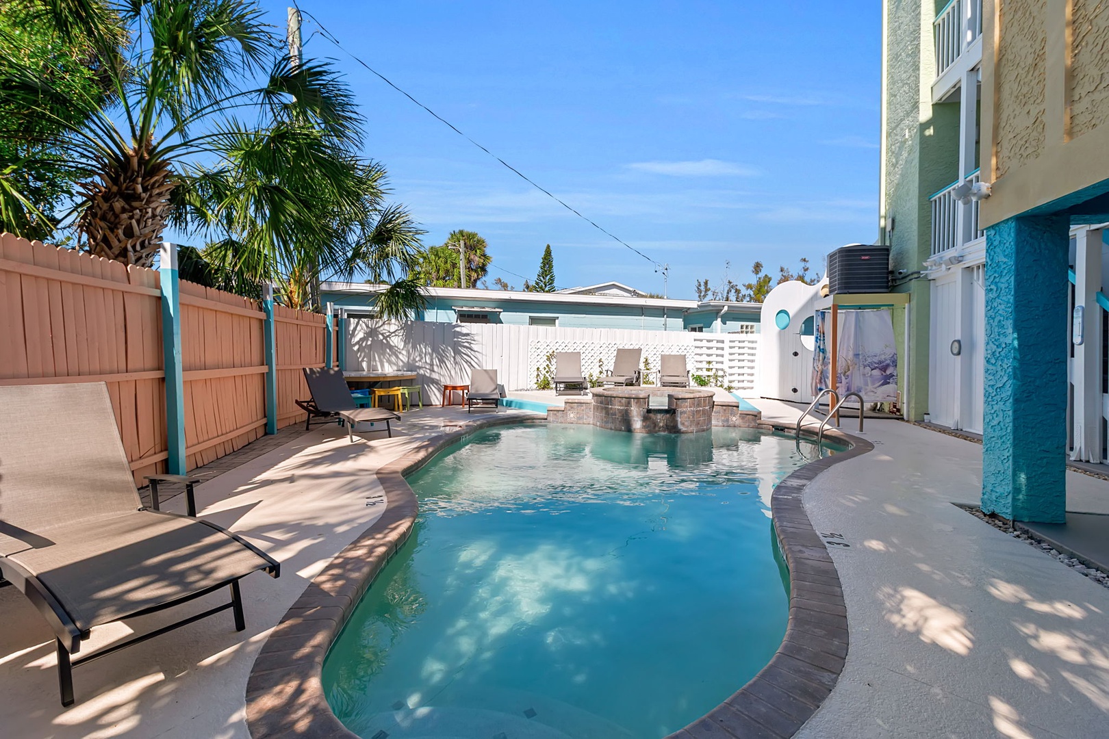 Dive into your private oasis surrounded by swaying palms and sunshine. Relax poolside, soak in the hot tub, or lounge under the warm coastal sky.