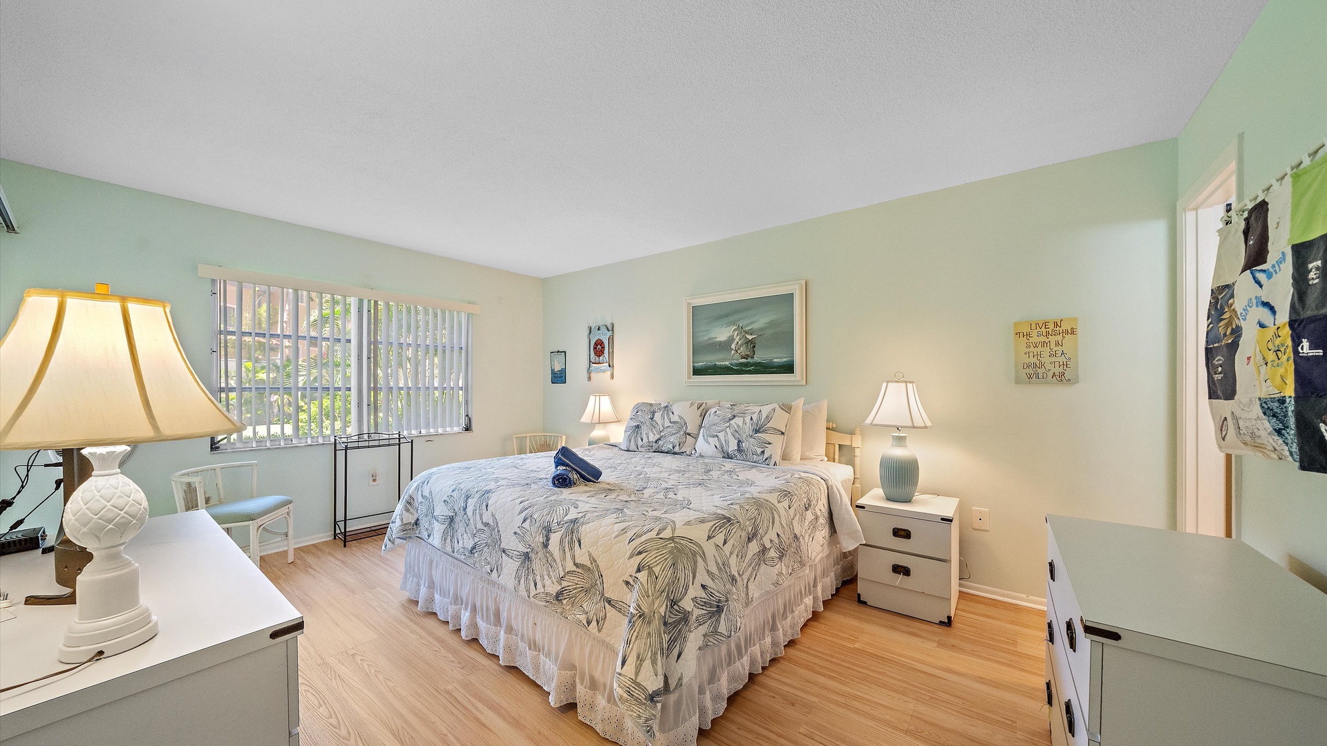 Unwind in your bright coastal bedroom with soft linens and tranquil ocean-inspired decor, where morning light spills through wide windows and the space feels effortlessly serene.