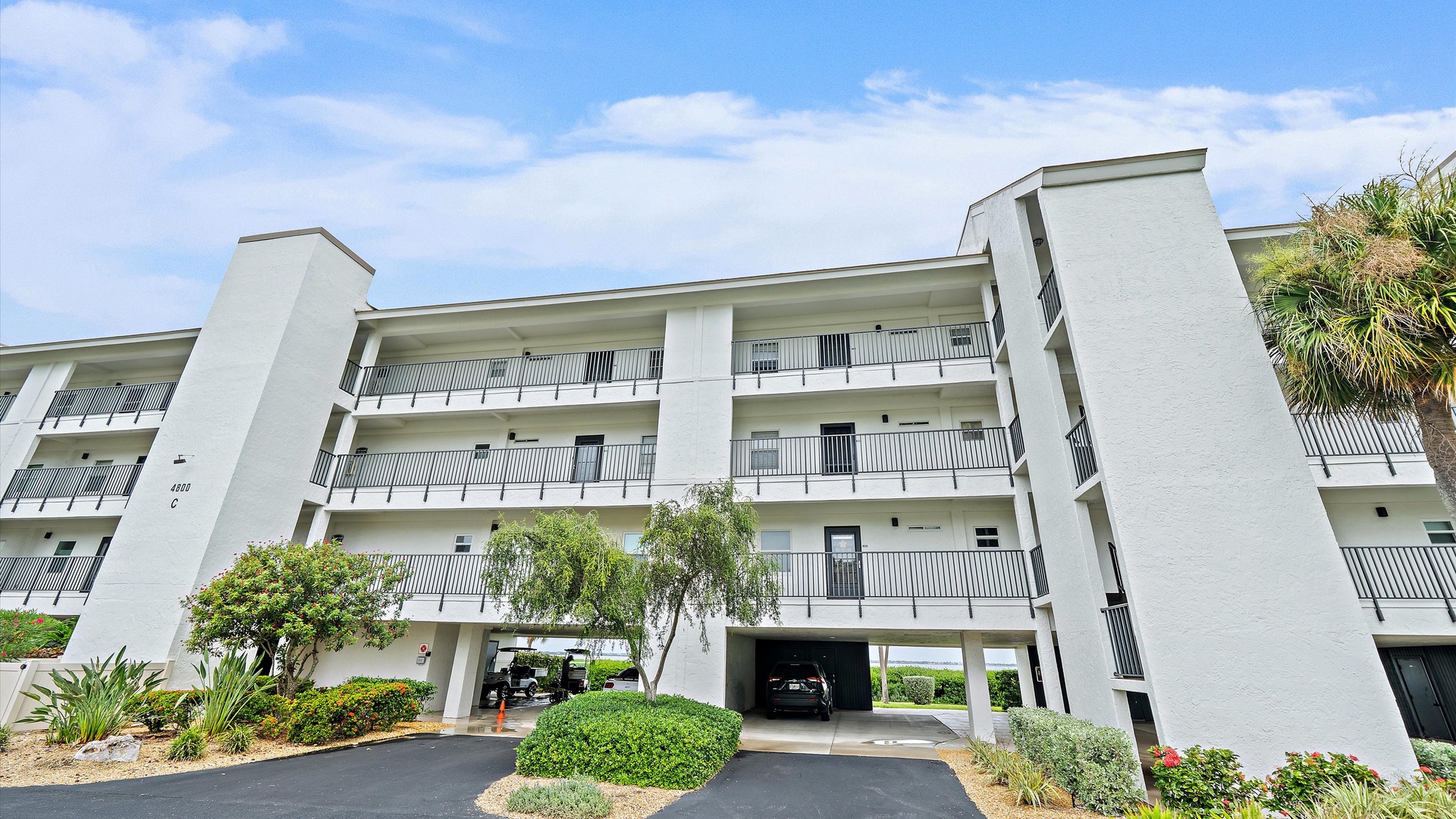 The building’s landscaped exterior and ground-level covered parking offer a welcoming arrival. Designated covered parking is included with your penthouse stay.